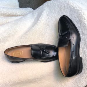 Black leather tassel loafers